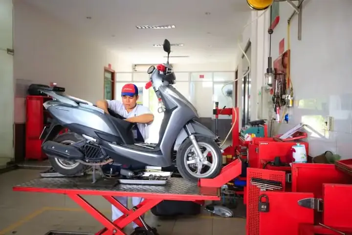 e-scooter mechanic working