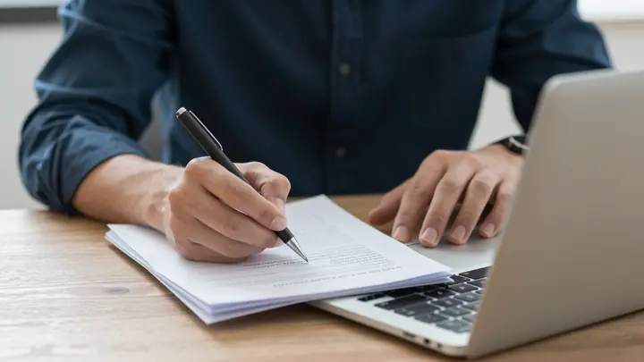 blogger writing articles laptop