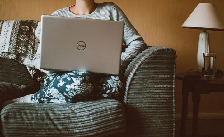 person working on laptop at home
